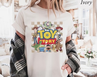 Comfort kleuren shirt met Toy Story-personage, Woody Buzz Jessie Rex Bullseye Slinky Alien graphic T-shirt, retro Pixar shirt comfort kleuren