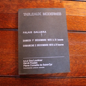 May include: A black and white poster advertising a modern art exhibition at the Palais Galliera in Paris, France. The exhibition is scheduled for December 1st and 2nd, 1973, from 9 pm to 11 pm. The poster lists the names of the auctioneers: Guy Loudmer, Hervé Poulain, and Pierre Cornette de Saint-Cyr.
