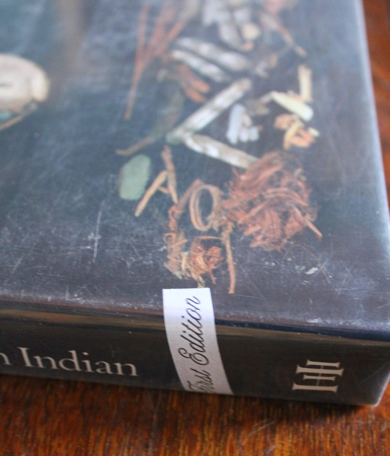 May include: A black book with the words 'First Edition' on a white label and the words 'Indian' and 'III' on the cover. The Arts of the North American Indian Native Traditions in Evolution Edwin L. Wade  Hardcover w dust Jacket First Edition ISBN 0-933920-55-5