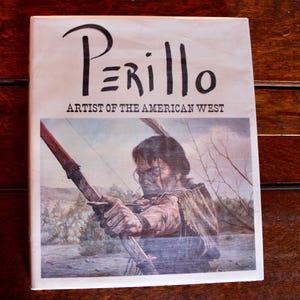 Może przedstawiać: Okładka książki z tytułem "Perillo Artysta Amerykańskiego Zachodu". Okładka przedstawia obraz przedstawiający Indianina z łukiem i strzałą.