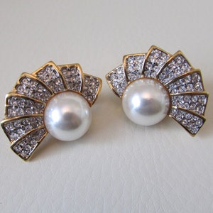 Fun shaped clip on earrings , signed Butler.