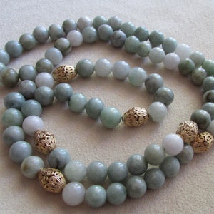 Jadeite necklace in soft Greene shades.
