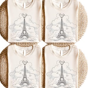Disney meets Paris in this magical tee featuring the Eiffel Tower with a classic Mickey Mouse head perched on top. Perfect for Disneyland Paris vacations, this design blends iconic French landmarks with beloved Disney charm. Ideal for families, travel lovers, or Disney fans making memories in the City of Light. A stylish and fun shirt for park visits, photo ops, or post-trip souvenirs.