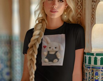 May include: Black t-shirt featuring a graphic of a white bunny wearing overalls and a red heart. The model is wearing a blue headband, gold earrings, a gold belt, and blue jeans. The background has a decorative wall.