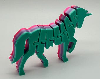 Juguete flexible de unicornio para la ansiedad, con impresión 3D, color verde azulado, morado y rosa degradado, articulado y sensorial para escritorio.