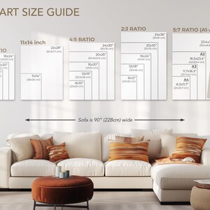 May include: Wall art size guide with various aspect ratios and dimensions in inches, including 3:4, 4:5, 2:3, and 5:7 (A1-A4). The sofa is 90 inches wide. The image shows a living room with a white sofa and orange pillows.