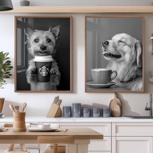 May include: Two framed black and white dog portraits. One shows a terrier holding a Starbucks coffee cup. The other depicts a golden retriever with a coffee cup. Both images are in brown wooden frames, suitable for kitchen or cafe decor.