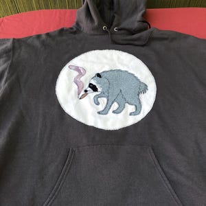 Handcrafted Jimothy with a “J” sweatshirt
