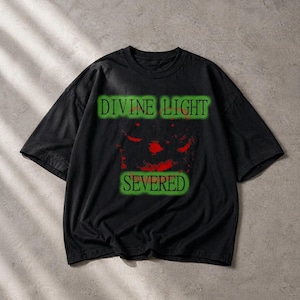 May include: Black t-shirt with the text "DIVINE LIGHT" above a red and black graphic, and the word "SEVERED" below. The text is in a green, glowing font. The shirt has short sleeves and a crew neck.