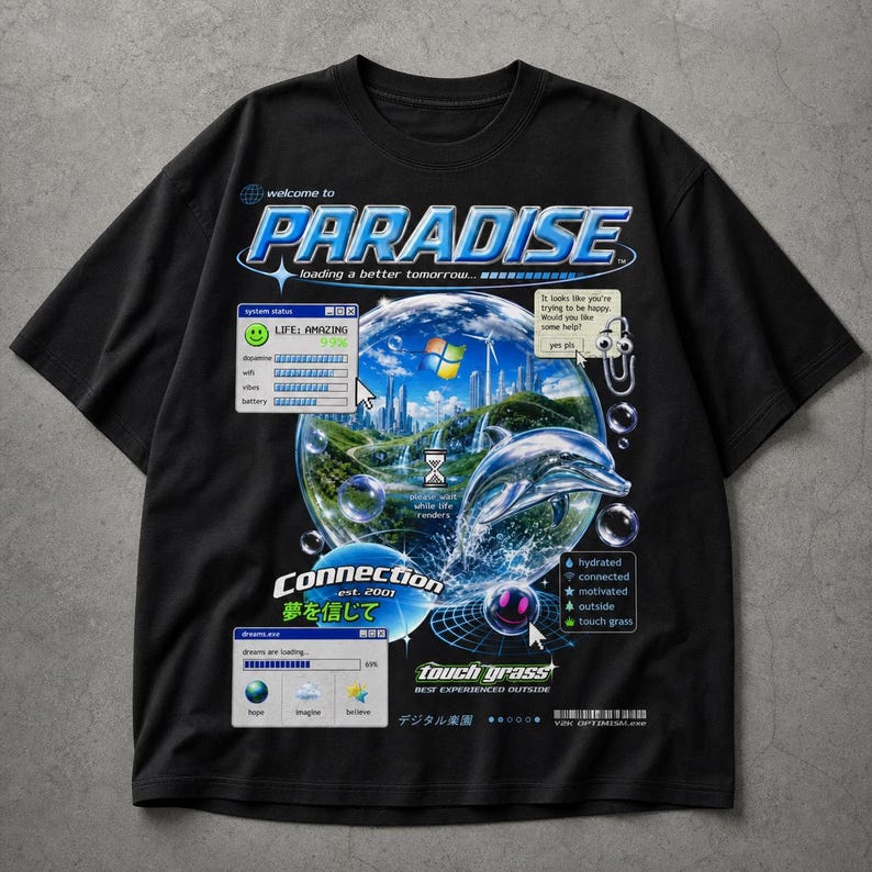 May include: Black t-shirt with a graphic design featuring the word "PARADISE" and a futuristic landscape inside a bubble. The design includes a dolphin, text that reads "touch grass", and Japanese text.
