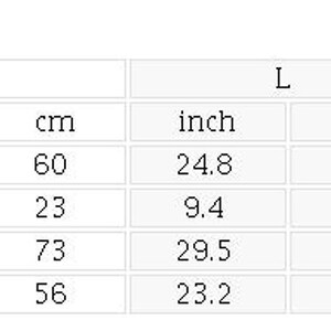 A size chart table displaying measurements in inches and centimeters for chest, sleeve length, length, and shoulder across sizes S through 2XL.
