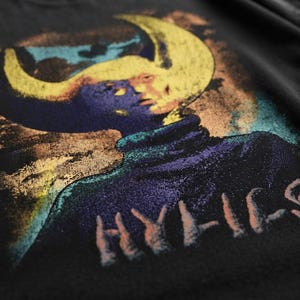 Close-up macro shot of the Hylics graphic printed on the cotton fabric.