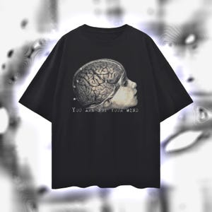 May include: Black t-shirt with a graphic print of a human head with a brain exposed and the text "You are not your mind".