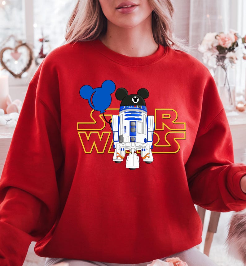 Star Wars shirt featuring fan-favorite characters like Darth Vader, Baby Yoda, Chewbacca, and Han Solo with fun Mickey head accents. This soft, unisex tee or sweatshirt is perfect for Disney trips, Star Wars Day, or matching family outfits. A playful mix of galaxy and Disney magic, ideal for park hopping, themed parties, or gifting to fans of the Mandalorian and the whole Star Wars crew.