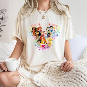 May include: A set of three ceramic vases in varying heights and shapes. The vases are glazed in a matte white finish, offering a minimalist aesthetic. The tallest vase is approximately 10 inches high.