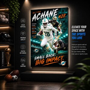 May include: A vertical sports wall art poster featuring De'Von Achane in a white Miami Dolphins uniform with the number 28, running with a football. The design includes the text "DE'VON ACHANE #28", "SMALL BACK. BIG IMPACT.", and the Dolphins logo.