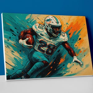 May include: Canvas art print of an American football player in a Dolphins uniform, number 28, running with the ball. The artwork features a dynamic, colorful abstract background with teal, orange, and beige tones. The player is wearing a helmet and gloves.
