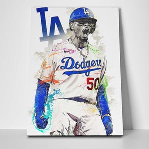 May include: A baseball player wearing a white jersey with "Dodgers" and "50" on the front, a blue cap with "LA" on it, and blue pants. The player is in a dynamic pose with a colorful paint splatter effect in the background.