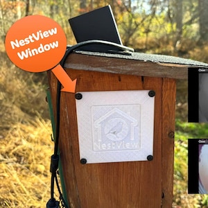 May include: A wooden birdhouse with a NestView Window label and a small black device on top. The birdhouse has a white square with the NestView logo. Two screens show before and after views of the bird box.