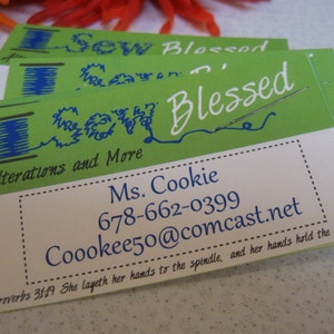 May include: Green and white business card with the text "Sew Blessed" and "Alterations and More". The card also includes a phone number, email address, and a quote from Proverbs 31:19.