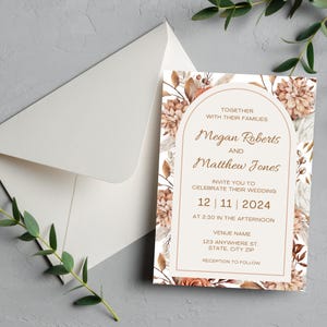 May include: Wedding invitation with floral design. The invitation features the names "Megan Roberts" and "Matthew Jones", with the date "12 | 11 | 2024". An envelope is visible in the background.