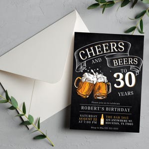 May include: A black birthday invitation with the text "Cheers and Beers to 30 Years." The invitation features two mugs of beer with foam and the name "Robert's Birthday." An envelope is in the background.
