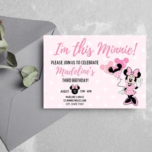 May include: Pink Minnie Mouse-themed birthday invitation with white polka dots. The invitation reads "I'm this Minnie!" and includes details for Madeline's third birthday party, featuring Minnie Mouse holding balloons.
