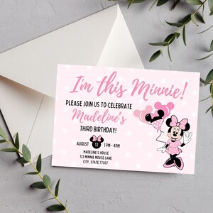 May include: Pink Minnie Mouse themed birthday invitation with white polka dots. The invitation reads "I'm this Minnie!" and includes details for Madeline's third birthday. A white envelope is visible in the background.