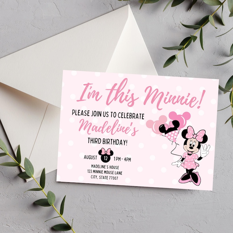 May include: Pink Minnie Mouse themed birthday invitation with white polka dots. The invitation reads "I'm this Minnie!" and includes details for Madeline's third birthday. A white envelope is visible in the background.