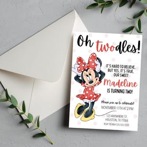 May include: A birthday invitation featuring Minnie Mouse in a red polka dot dress and bow. The invitation reads "Oh twodles!" and includes the name "Madeline" and party details. An envelope is visible in the background.