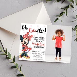 May include: A birthday invitation featuring Minnie Mouse with the text "Oh twodles!" and "Madeline is turning two!" The invitation includes a photo of a young girl in a red shirt and black pants.