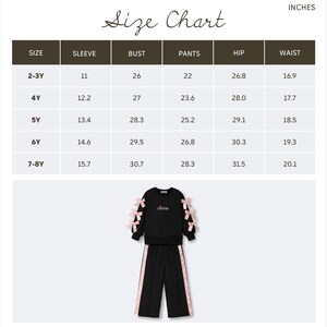 May include: Black children's outfit with pink bow accents on the sleeves and pants. The outfit includes a sweatshirt with the name "claire" and matching pants with pink stripes. An inches size chart is also included.