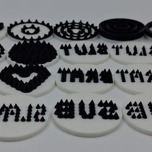 May include: A collection of white and black decorative elements. The designs include paw prints, hearts, geometric patterns, and text. The text includes the words "TA TA" and "BUZZ ME".