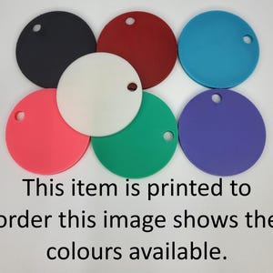 May include: Six circular tags in black, red, blue, white, pink, green, and purple, each featuring a single hole near the edge. The text reads: This item is printed to order this image shows the colours available.