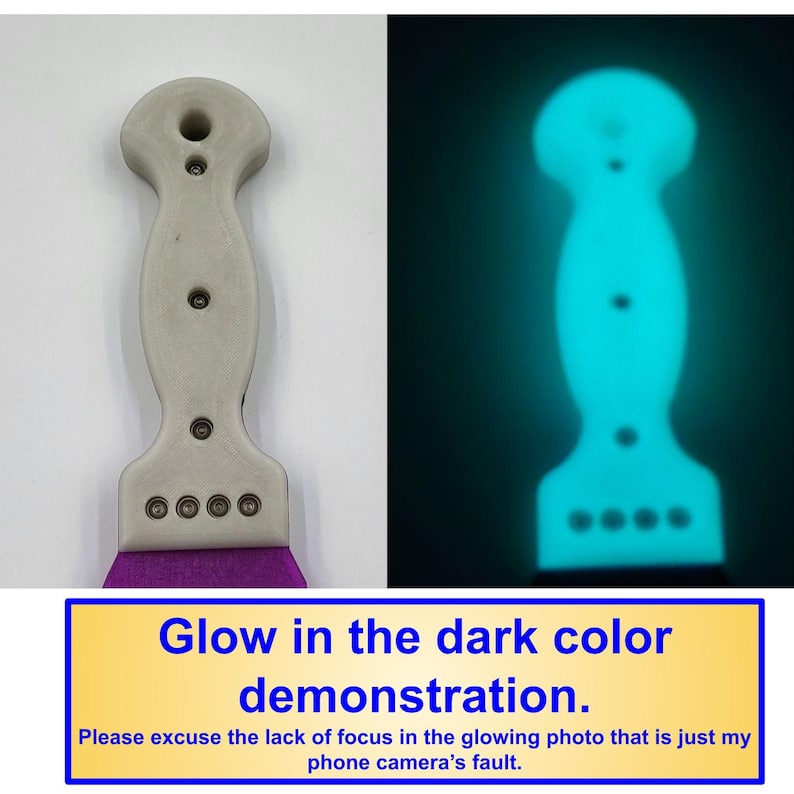 May include: A tool handle with a light gray, contoured shape featuring a top hole and four circular metal fasteners at the base. The handle is shown in daylight and in a dark environment where it emits a bright, cyan glow in the dark.