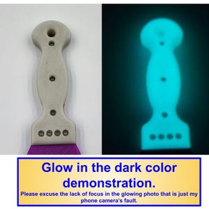 May include: A two-part image shows a tool with a handle and a purple blade. The left side shows the tool in a light color, while the right side shows the tool glowing a bright blue. The text in the image reads "Glow in the dark color demonstration."
