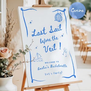 Op de afbeelding: Een wit bord met blauwe letters met de tekst "Last Sail Before the Veil!"  Welkom bij Amelia's vrijgezellenfeest Let's Party!"