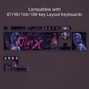 May include: Keyboard keycaps with a Jinx theme, featuring artwork of the character in shades of blue, pink, and purple. The keycaps are designed for 87, 98, 104, and 108-key layout keyboards. The word "JINX" is prominently displayed.