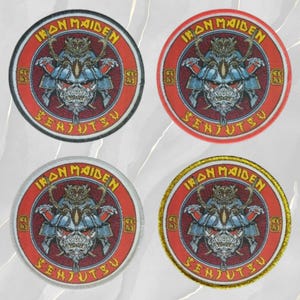 May include: Four circular embroidered patches featuring the Iron Maiden Senjutsu album artwork. Each patch displays a blue samurai helmet with a skull face, set against a red background with yellow text. The borders are black, red, white, and gold.