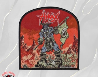 May include: A semi-circular embroidered patch featuring a blue horned creature holding a flag with a circular emblem. The background is a red landscape with mountains. The text reads Hirax at the top and Thrash and Destroy at the bottom right.
