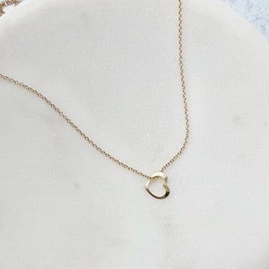 a gold open heart necklace