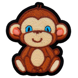 May include: An embroidered monkey with brown and beige fur, blue eyes and a black outline. The monkey is sitting with its legs crossed and has a happy expression.