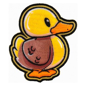 May include: Embroidered patch featuring a cartoon duckling. The duckling has yellow feathers, a brown chest, and an orange beak and feet. The patch is outlined in black and gold. This patch is suitable for jackets, bags, or other fabric items.
