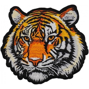 May include: Embroidered patch featuring a detailed tiger head. The design showcases orange, black, and white stripes, with a black border. The tiger's face is rendered with intricate stitching, capturing the animal's fierce expression. This patch is suitable for jackets, bags, or other fabric items.