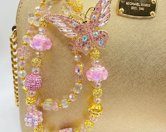Cadena con dije para bolso con diamantes de imitación y mariposa rosa: cadena para teléfono con cuentas de cristal hecha a mano, llavero con brillo brillante.