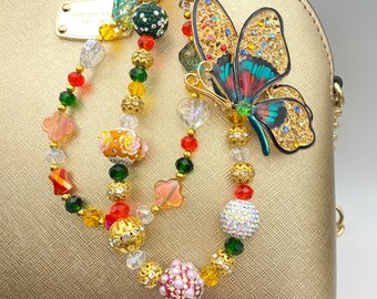 Cadena con dije de mariposa lateral de filigrana para bolso con diamantes de imitación: cadena para teléfono con cuentas de cristal, llavero, color naranja cósmico