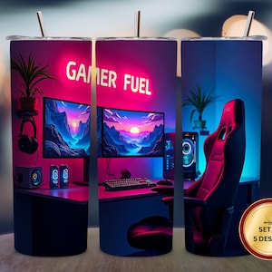 May include: A set of five stainless steel tumblers with a gaming theme. Each tumbler features a vibrant design of a gaming setup with the text "GAMER FUEL" in neon. Includes a red gaming chair, monitors, and a keyboard.