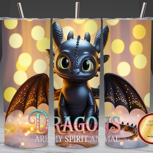 May include: A tumbler featuring a black dragon with large green eyes and black wings. The text "DRAGONS ARE MY SPIRIT ANIMAL" is displayed in colorful letters. The background has a bokeh effect with yellow and white circles.