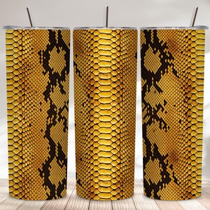 May include: Three stainless steel tumblers with lids and straws. The tumblers feature a yellow and black snakeskin pattern. The design is a repeating pattern of yellow scales with black markings. The tumblers are cylindrical and sit on a wooden surface.