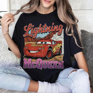 May include: A set of three ceramic mugs with a speckled, matte finish. The mugs are in shades of cream, light gray, and dark gray. Each mug has a simple, minimalist design, perfect for coffee or tea.